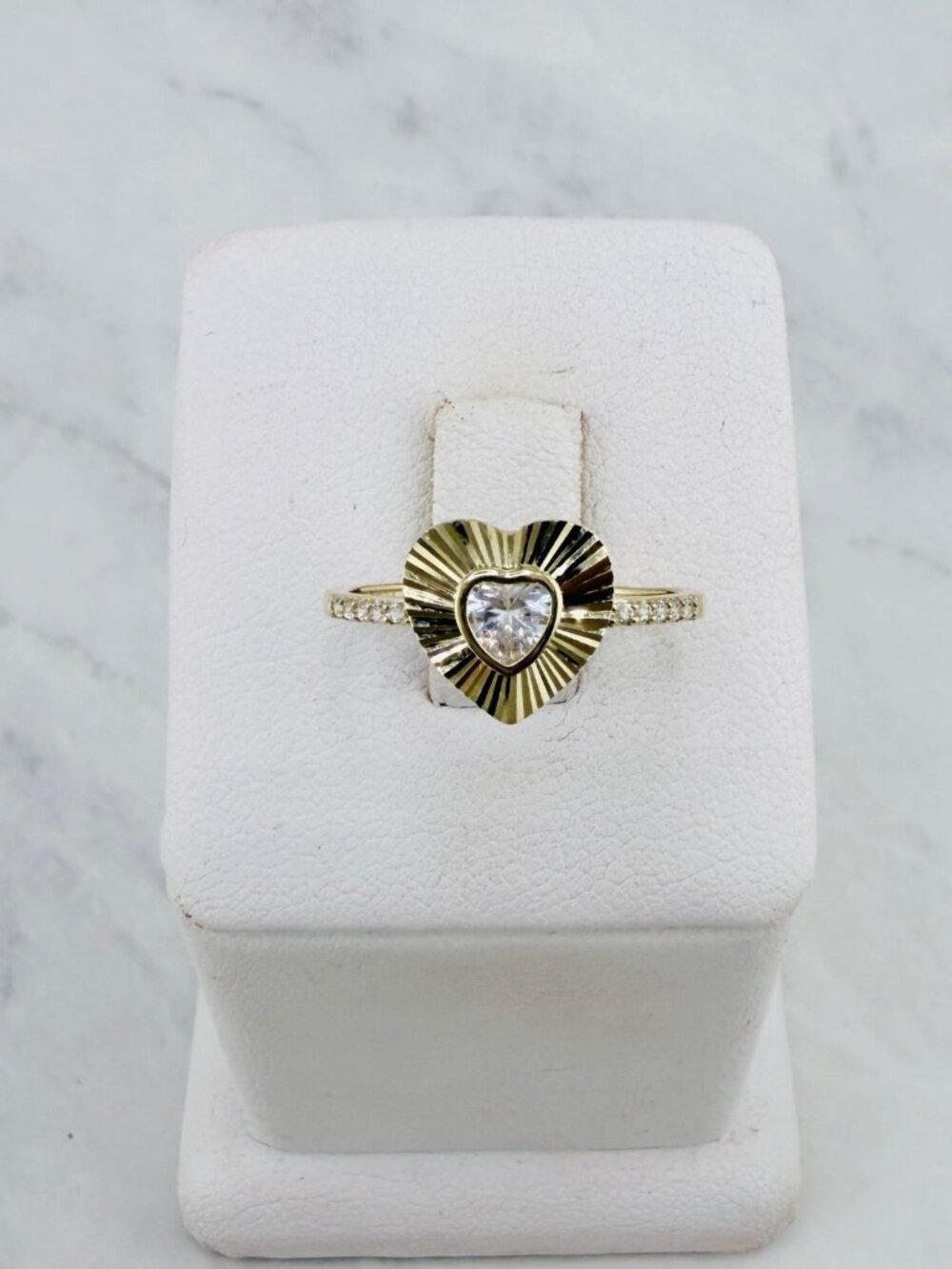 A timeless dainty and elegant 10K solid gold heart.